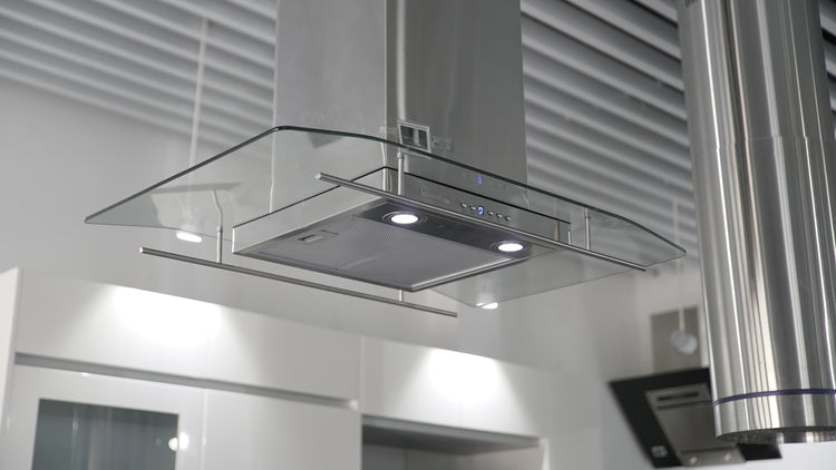 a kitchen hood mounted on the wall above a stove